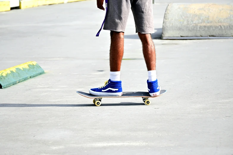 a skateboarder riding a skateboard down the street