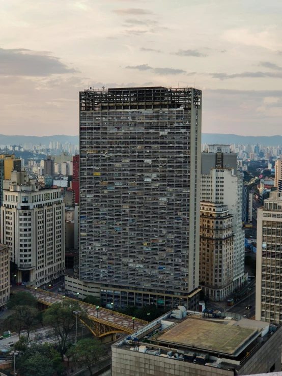 a very tall city with tall buildings and some cars