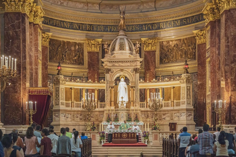 a group of people are gathered at the alter of a church