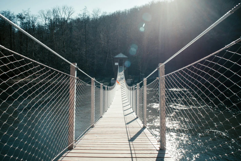 an empty walkway next to a forest and light house