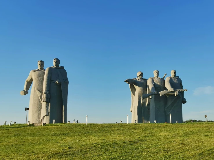 three large statues that appear to be like hands