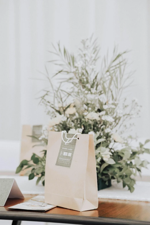 an empty shopping bag sitting on top of a wooden table