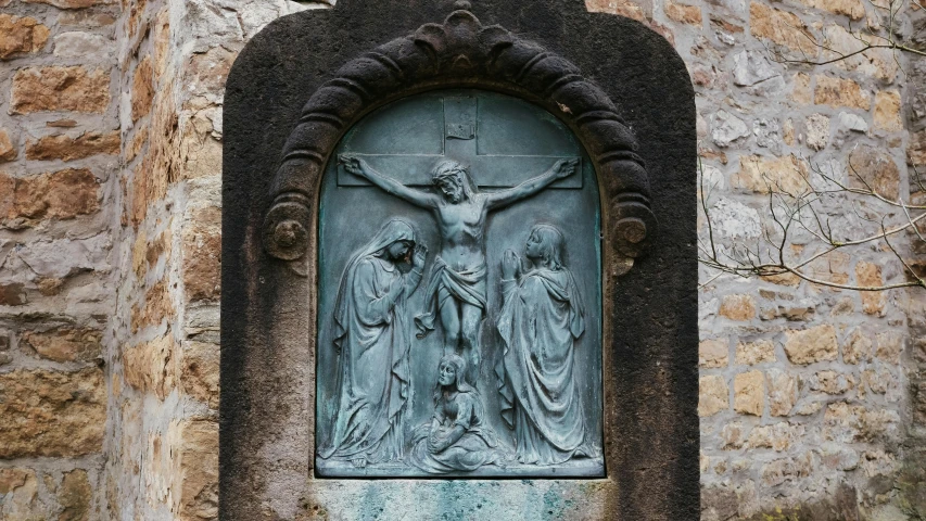 an intricate marble wall decoration depicting the cross