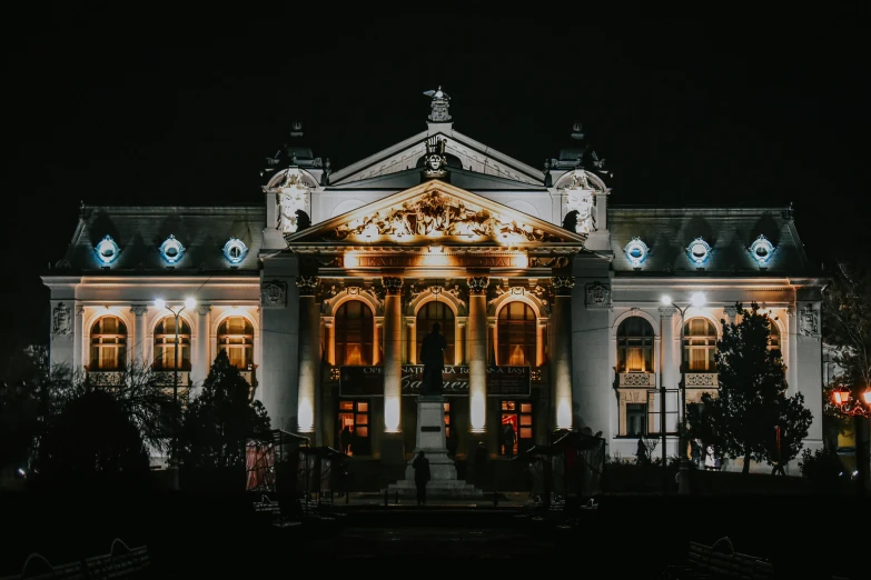 large white building with lighted decorations on the front