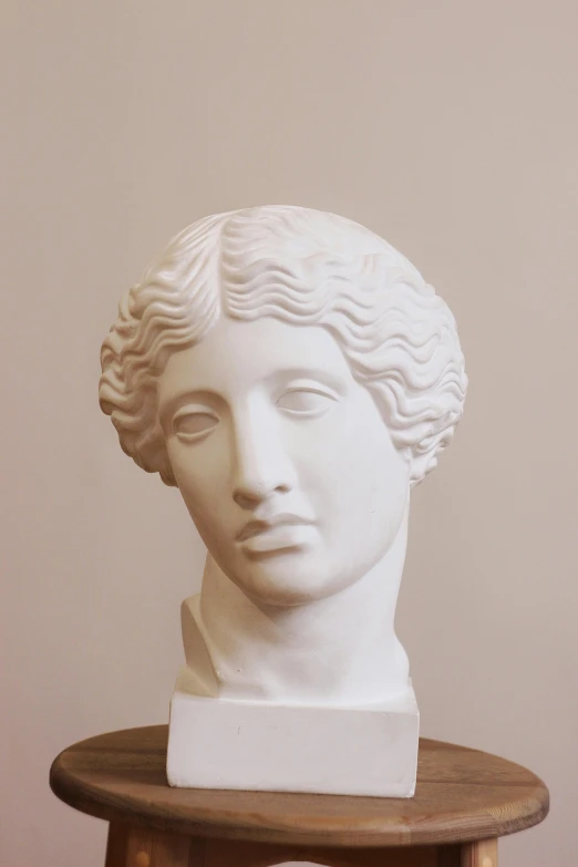 a close up of a bust of a woman on a table