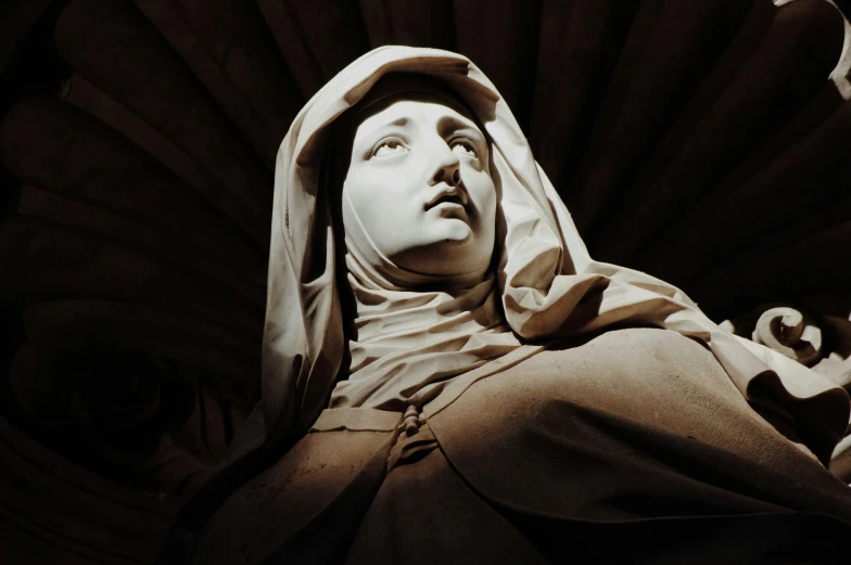 a close up view of a statue in the darkness