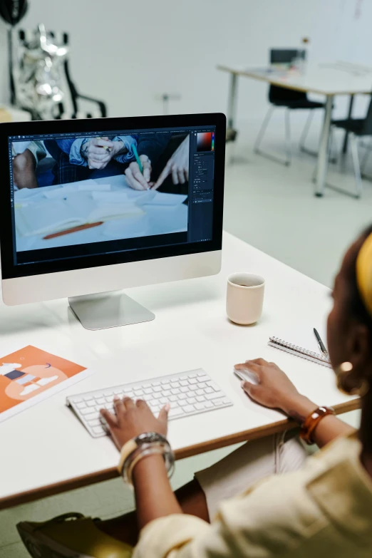 a person wearing headphones and working on a computer