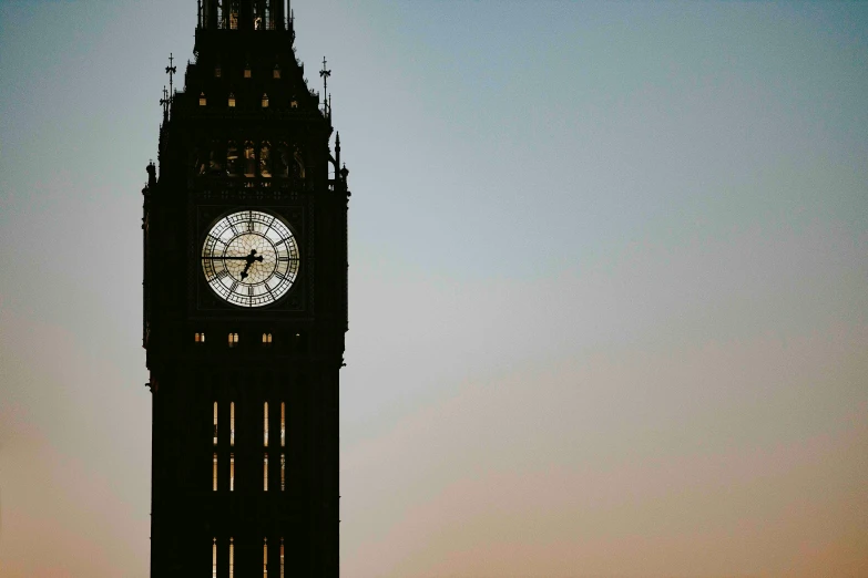 a large clock tower lit by the moon