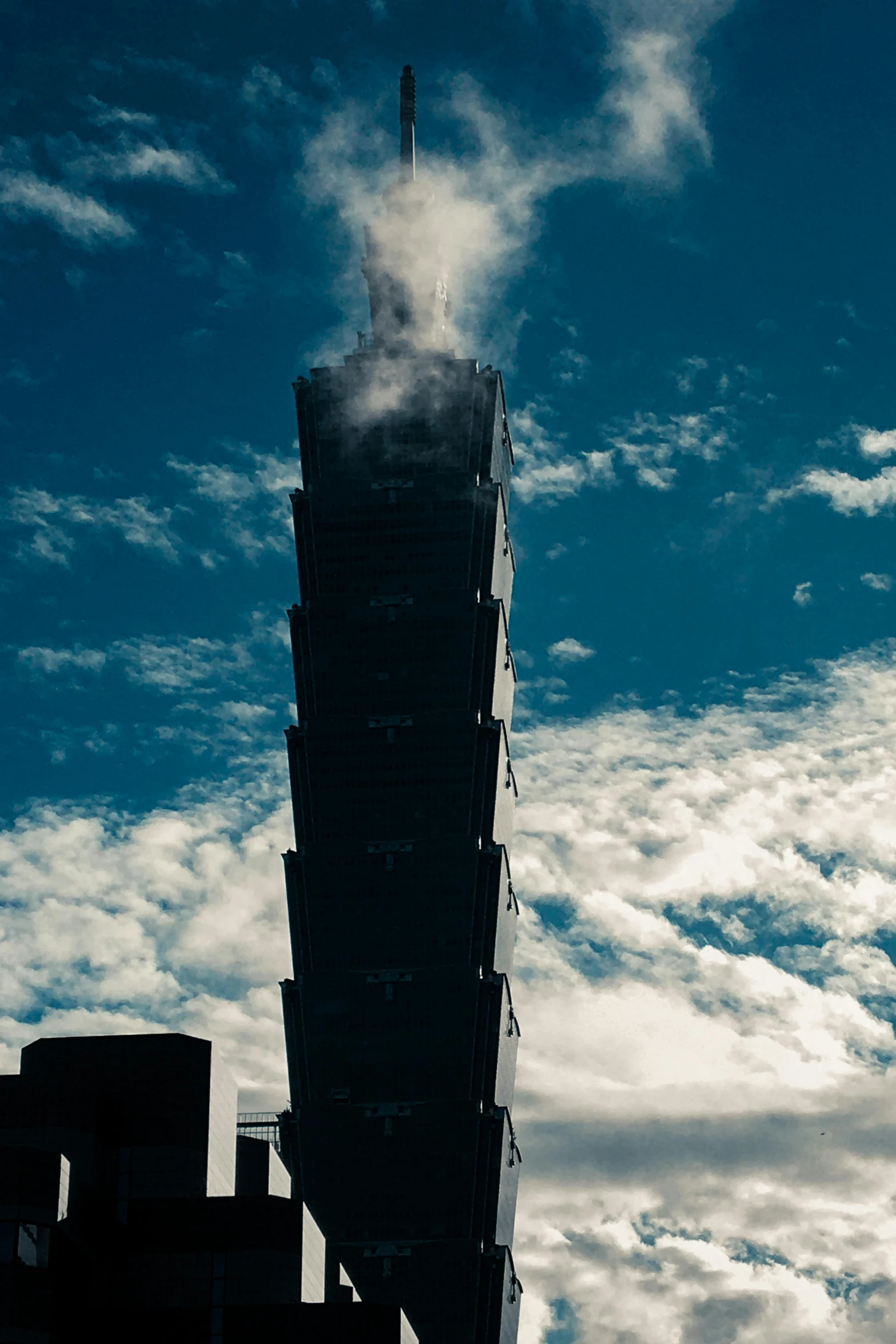 the smokestack is sticking out of a tall building