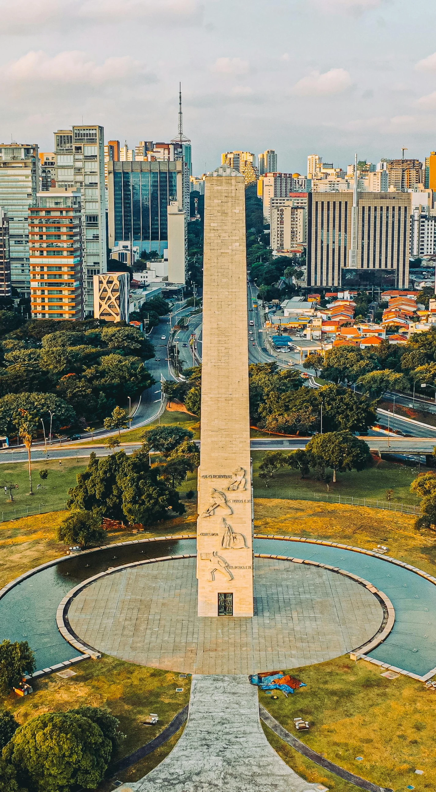 a view of a large monument, with buildings in the background