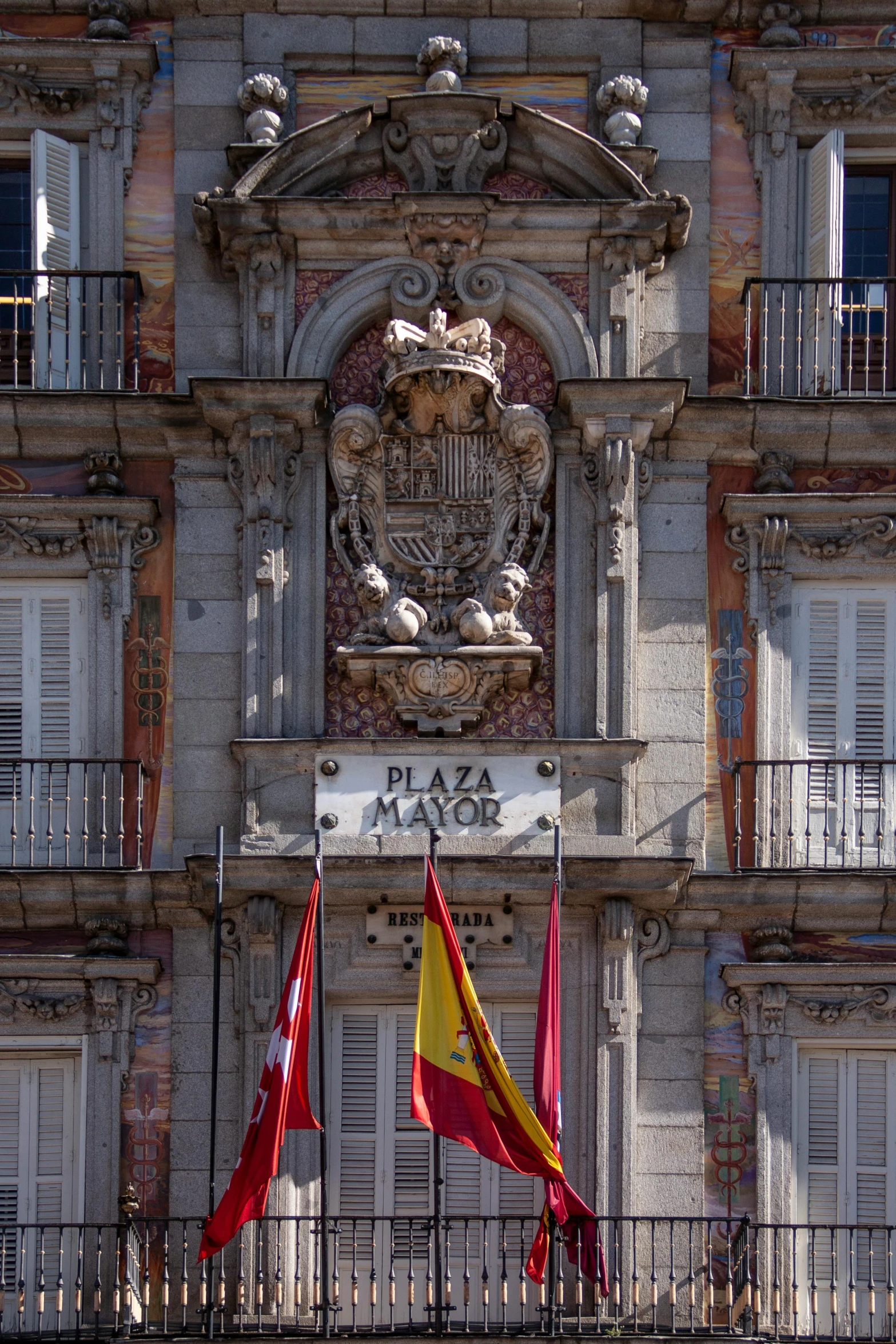 the flags are flying in front of a building