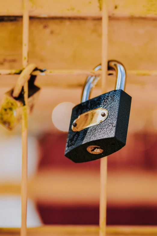 an open lock is attached to the fence