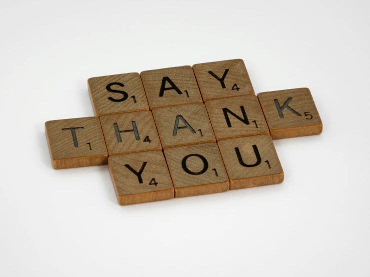 some type of tile with words saying say thank you