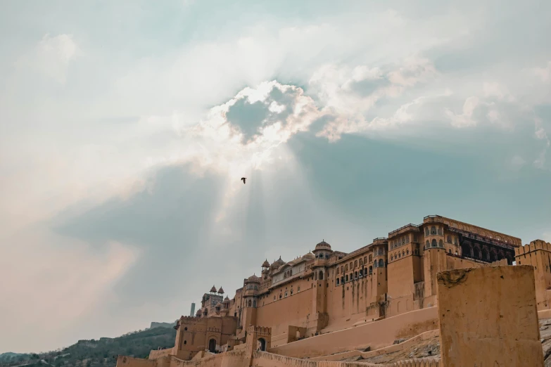 a large castle with a sky in the background