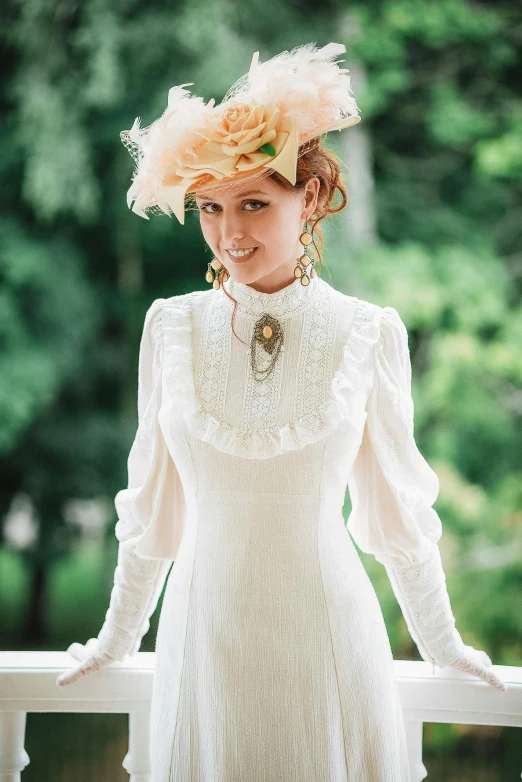 a beautiful young woman dressed in a white dress