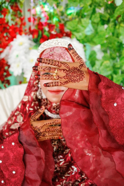 woman in red with arabic clothing with palm hand painted