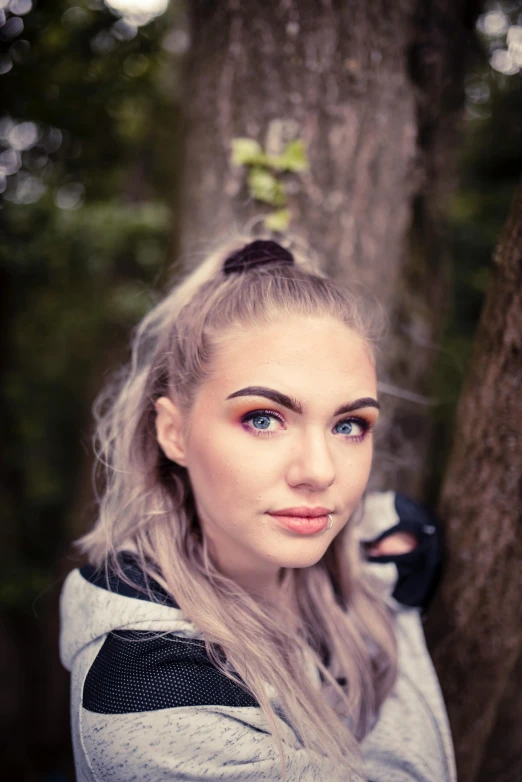 the beautiful woman is posing with a bow