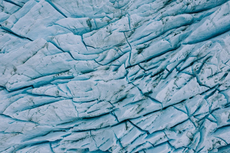 a blue glacier showing how the ice is getting smaller