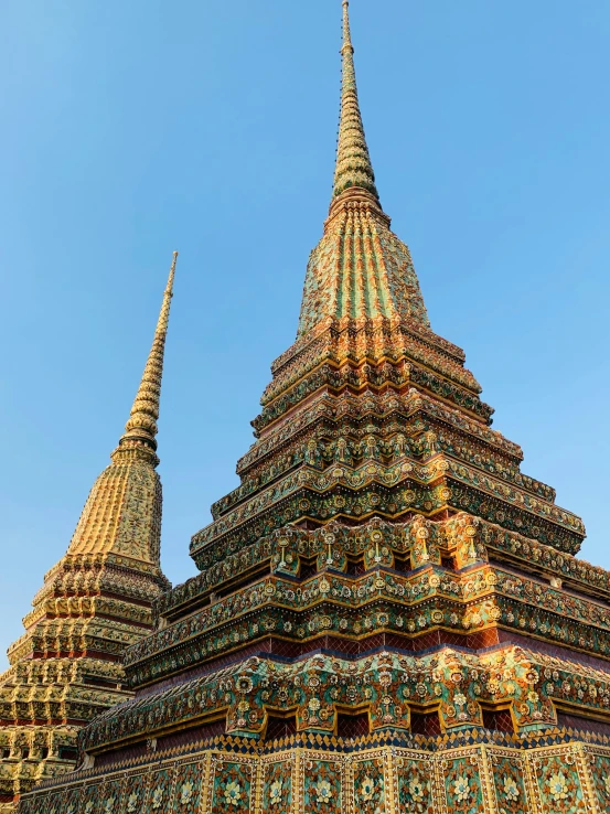 an ornate tower that is next to some stairs