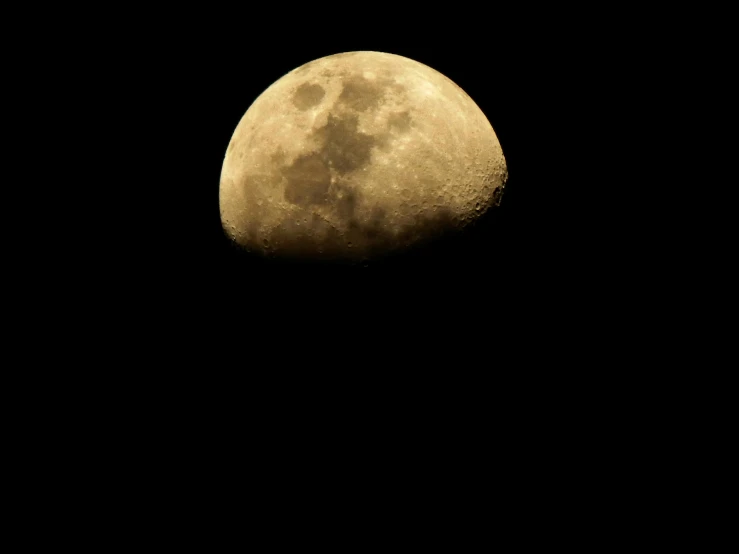 the moon appears very thin and clear on the black sky