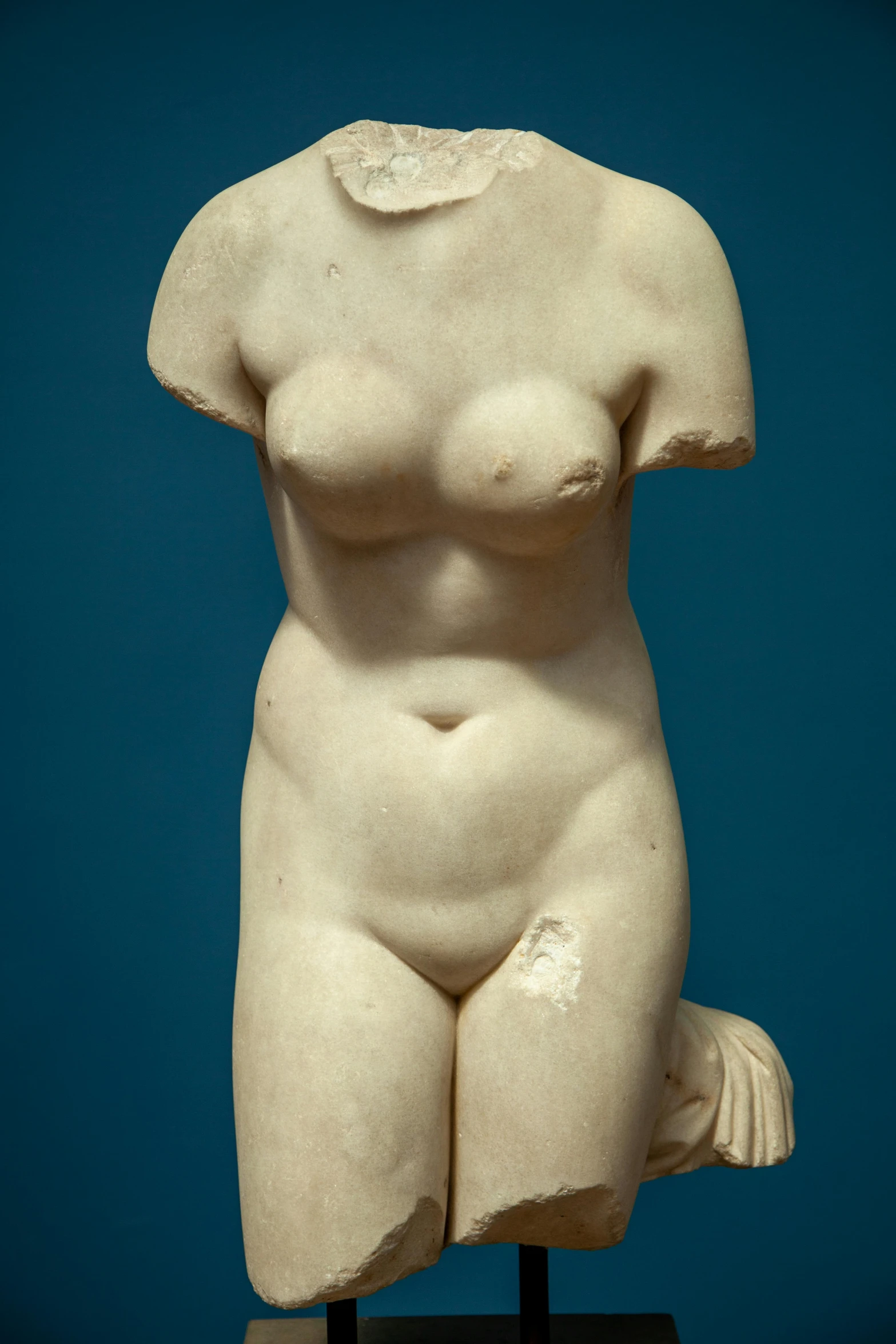 a large white sculpture of a woman with 