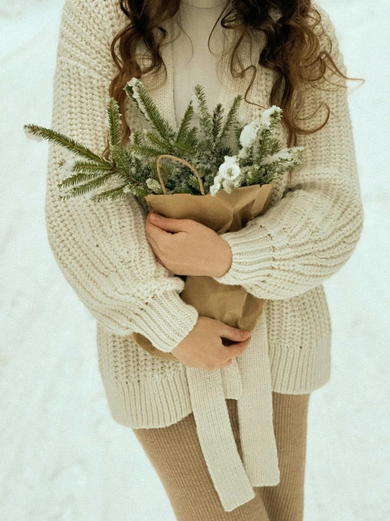 a woman wearing tights and holding a flower bouquet