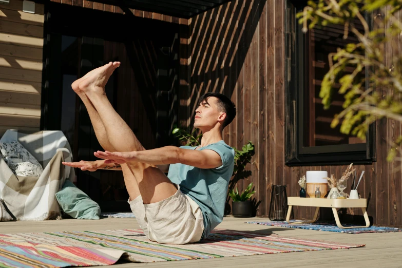 a man stretches out on his yoga mat