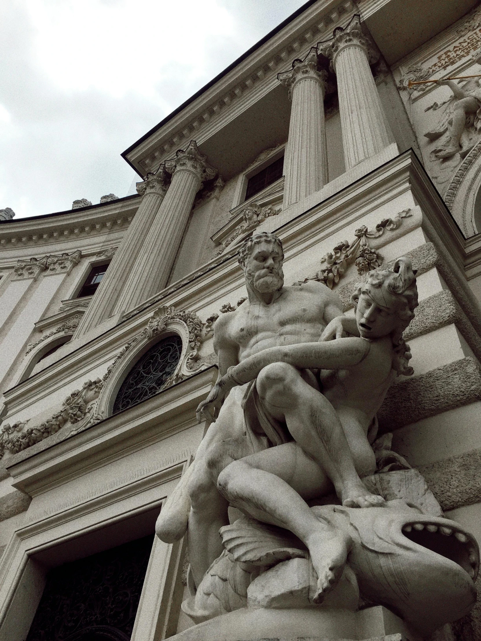 this is a statue at the entrance to an old building