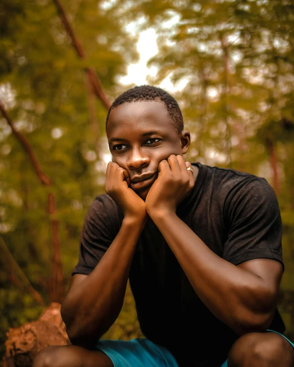 the young man is posing for a picture