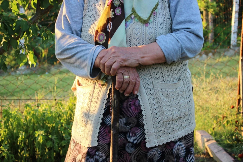 a lady is holding an umbrella with her hand