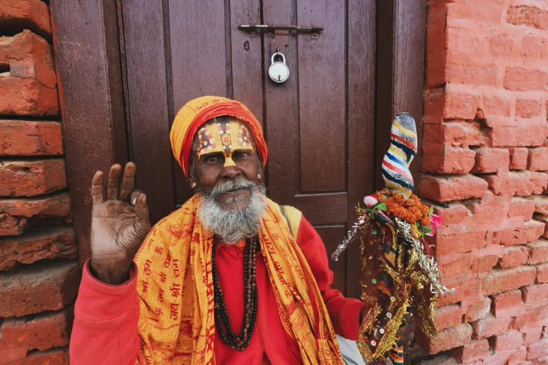 an old man is dressed in bright colors