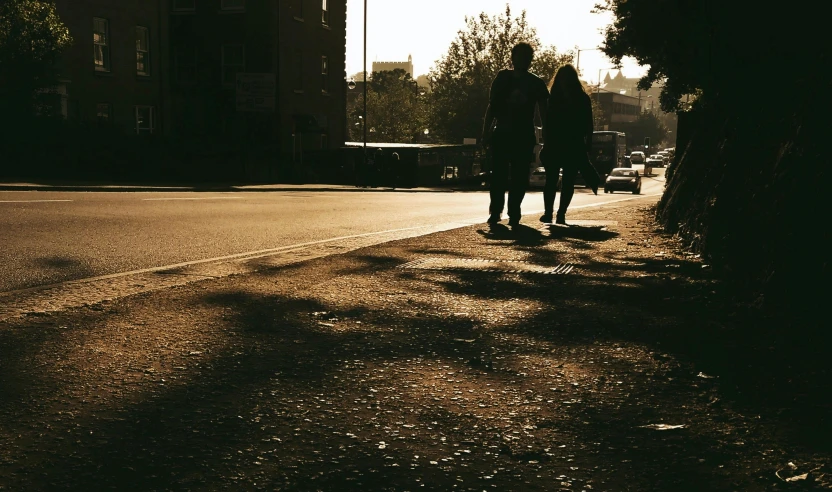 people standing along a street talking to each other