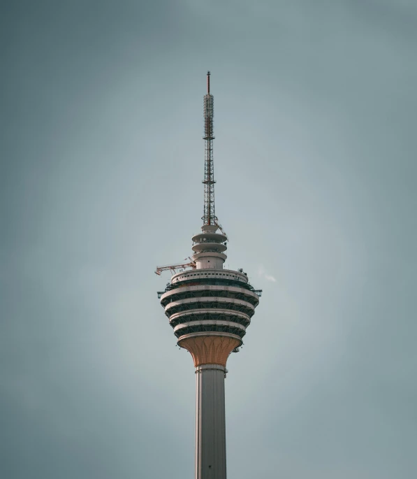 a tall tower in the middle of an empty field