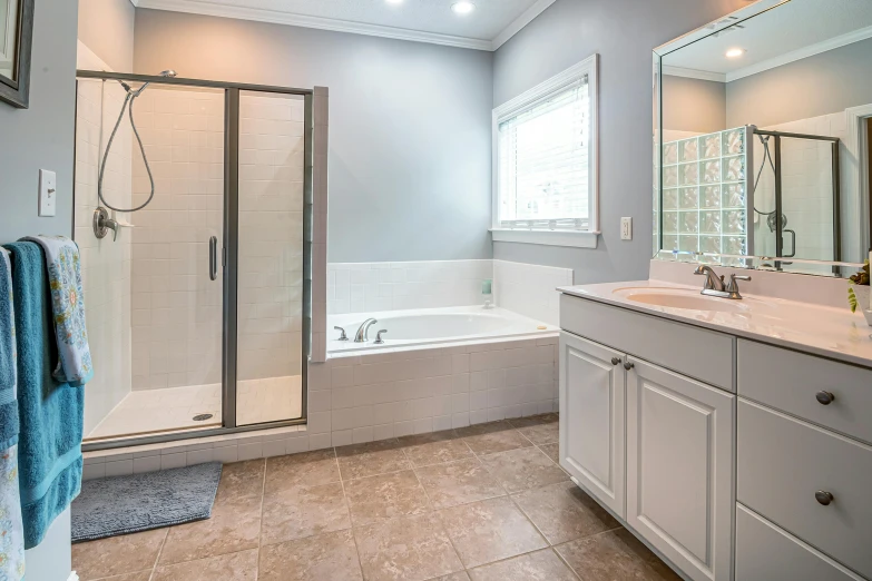 a bathroom with gray walls and tile floors