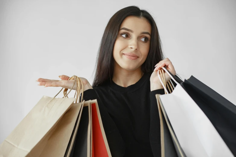 a woman holding up many shopping bags with the words,'$ 4 off on all the prices '