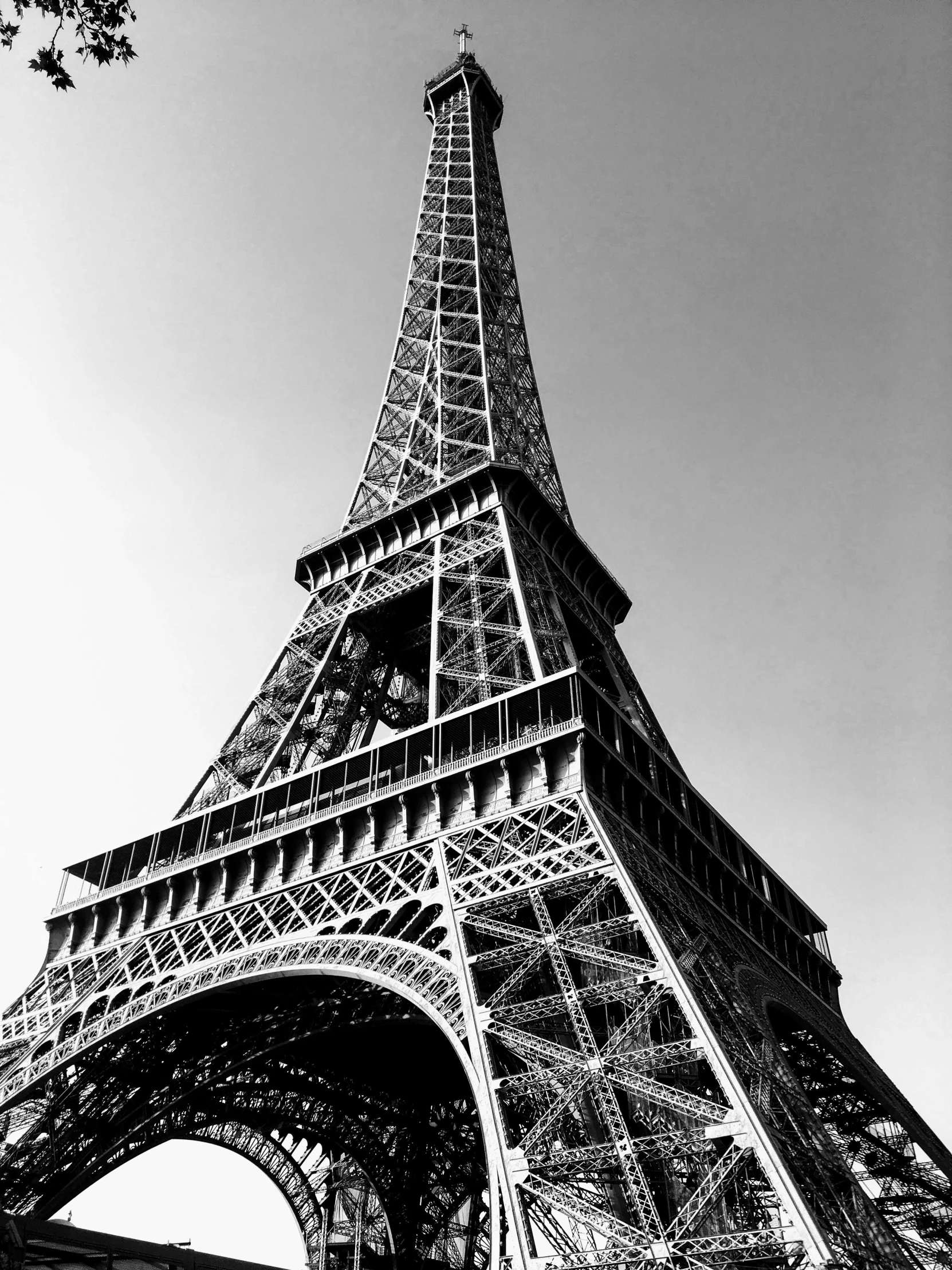 the eiffel tower is very tall in black and white