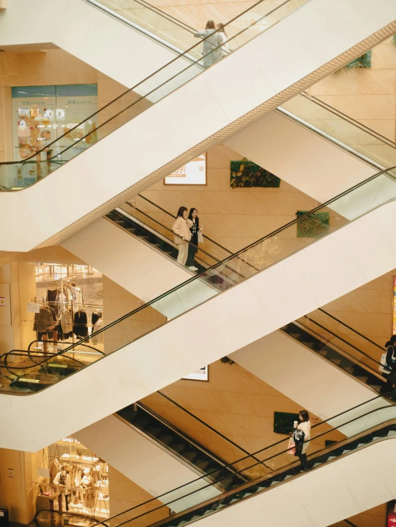 people are walking up and down stairs in an office building