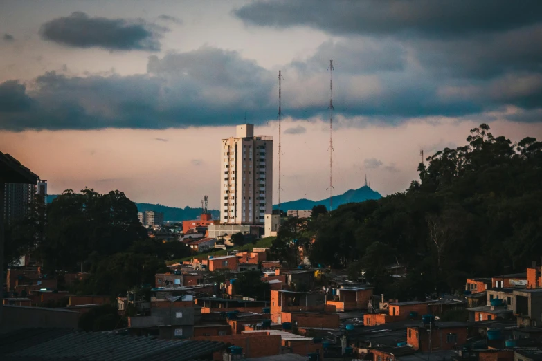 a small town with tall buildings surrounded by trees