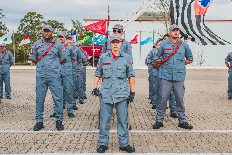 a group of men in blue uniforms standing next to each other