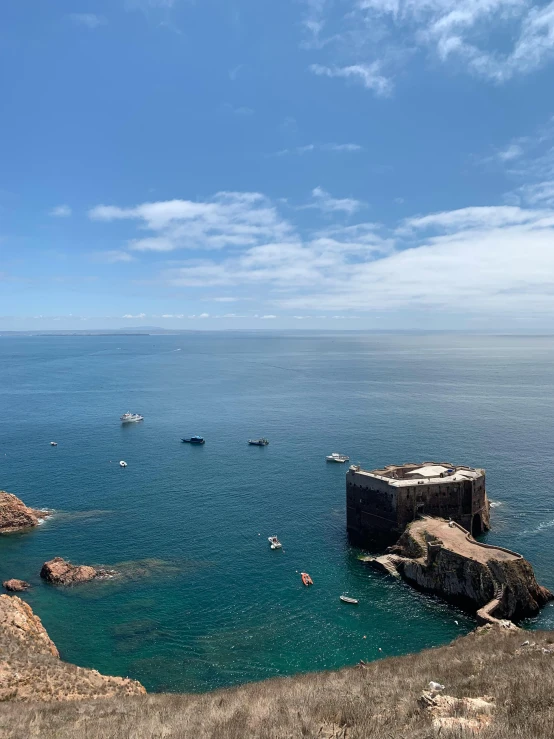 a boat is sitting in the water near rocks