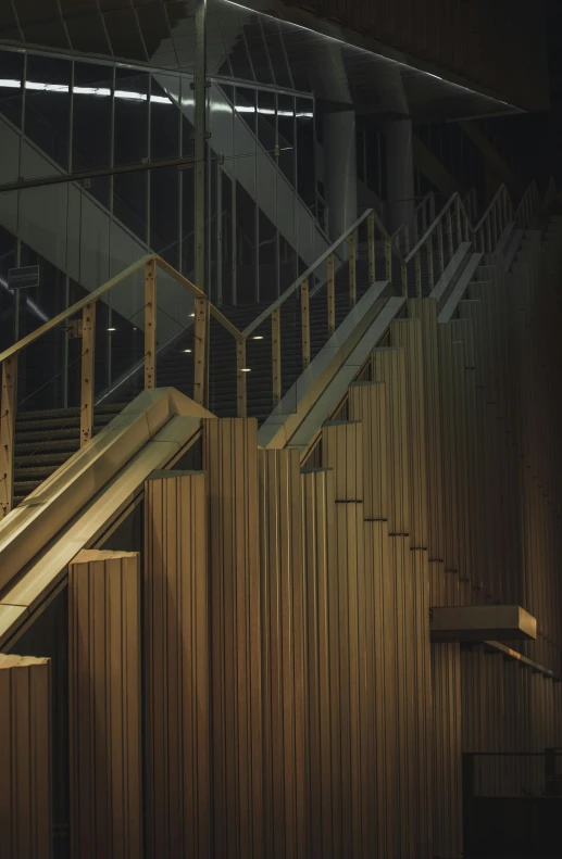 a staircase made out of wooden boards in front of an open window