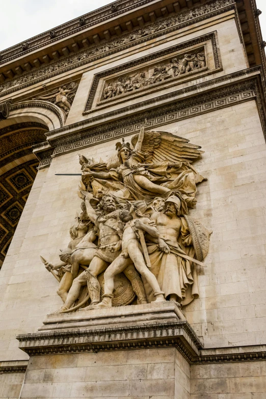 an elaborate statue has been placed on the side of a building