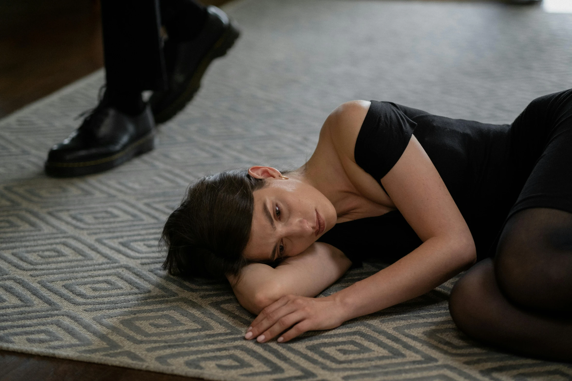 a woman laying on the floor of her house