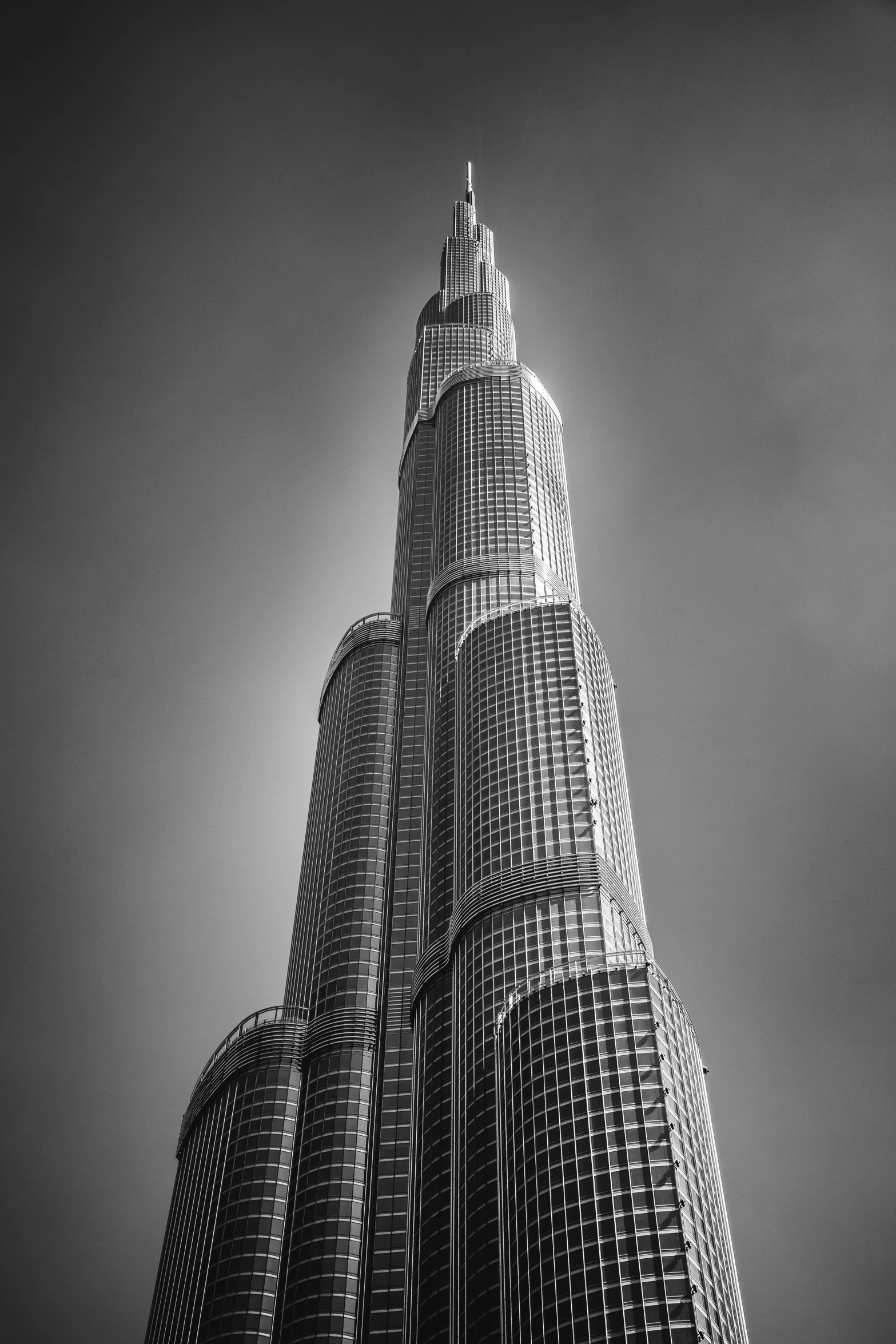 the view from below of two very tall buildings