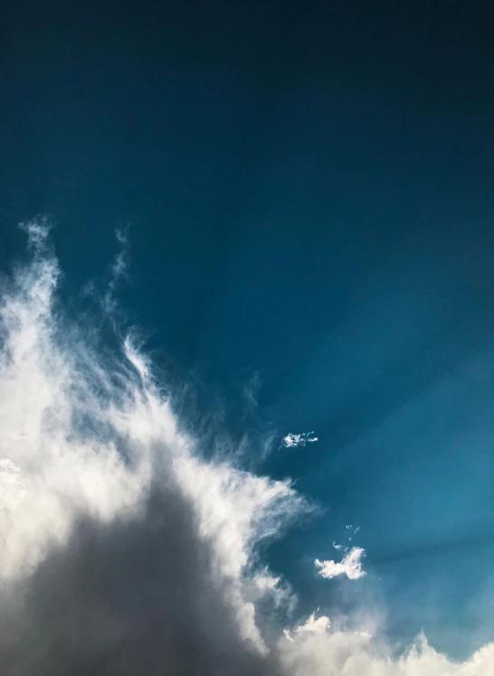 the sky is filled with large white clouds