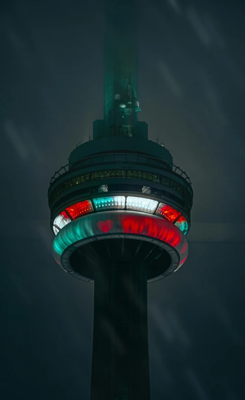 a large tower with lights lit up on it