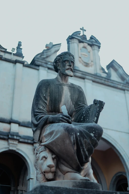 the statue has a book in its hand