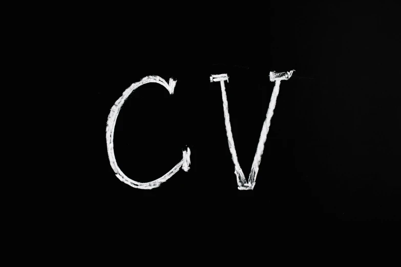 a black background with the letter c v in white