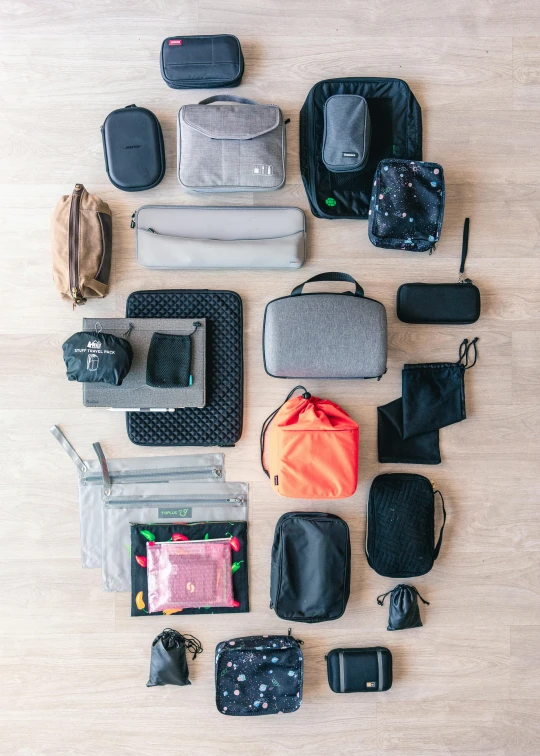 the contents of several bag laid out on a wooden surface