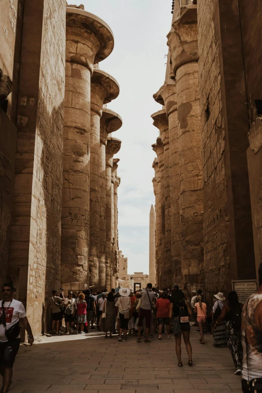 a large group of people at the entrance to a museum